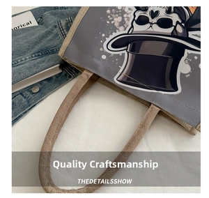 Detail of the woven rope handle and skull print on a stylish canvas tote bag