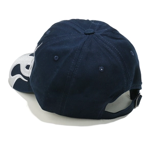 Detail showing white flame embroidery on navy baseball cap with metal buckle