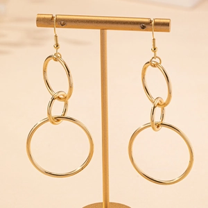 Fashionable gold-colored triple hoop drop earrings with minimalist metal design