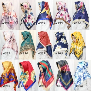 Collage of fifteen geometric and floral satin silk square scarves with model display