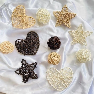 Handcrafted rattan heart, star, and ball decorations in brown, beige, and white colors