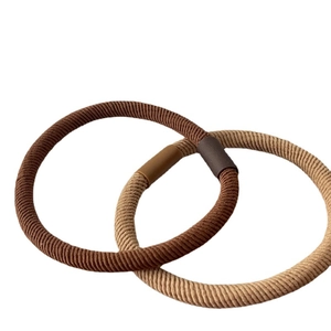 Elastic hair ties in earthy brown tones with durable woven texture and plastic connectors