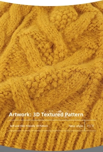 Macro shot of ginger yellow knit beanie showing thick cable patterns and soft texture