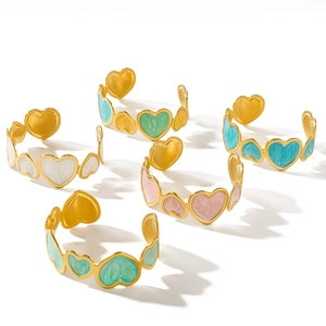 5-piece gold heart bangle set with colorful enamel inlay on a clean white background