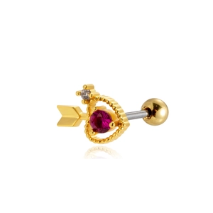 Detail of heart and arrow gold earring with red gemstone and white crystals