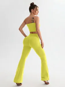 Neon yellow seamless yoga set with backless sports bra and high waisted flared leggings