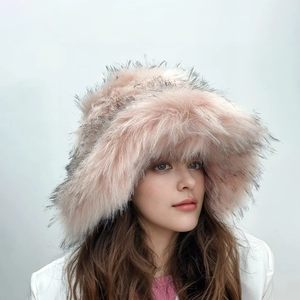 Detail of pink and grey faux fur gradient bucket hat with soft plush texture on a model
