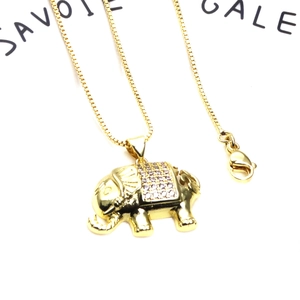 Macro shot of gold-plated elephant pendant with micro-paved cubic zirconia and box chain