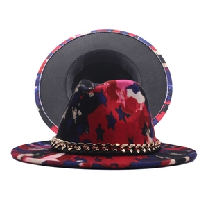 Detail of jazz fedora with colorful star print and decorative gold metal chain link