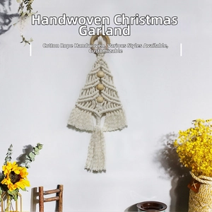 Detailed macro view of ivory cotton macrame Christmas tree hanging with wooden beads