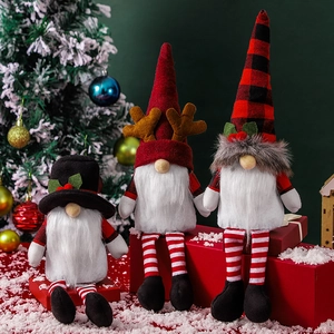 Three Christmas gnomes with plaid hats and long beards sitting on red gift boxes