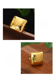 Detail of gold square ring with hammered metal texture made of durable stainless steel