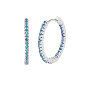 Macro shot of silver S925 hoop earrings with paved blue zircon stones on white background