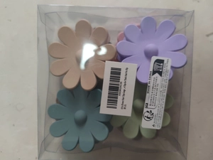 Bulk set of 8 flower hair claws in muted Morandi tones inside a clear storage box