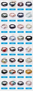 Selection of numbered fabric criss-cross headbands in various colorful patterns and prints