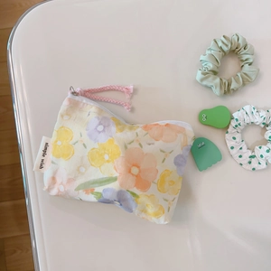 Floral cotton mini storage pouch with zipper and pink cord, shown on a white background