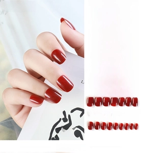 Detail of 24pcs deep red wine glossy press-on nails with shiny enamel finish