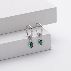 Detail of S925 silver hoop earring featuring a pear-cut green zircon and white accent stone