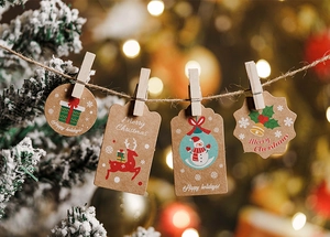 Thick Christmas kraft paper hanging tags with wooden clips and twine for holiday gift decoration.