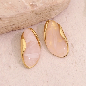 Elegant gold-framed marble resin stud earrings in a minimalist geometric oval design