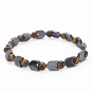 Tiger eye and gray metallic hematite arrow bead bracelet on a white background