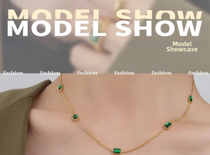 Close-up of 18K gold plated necklace with rectangular emerald zircon stones on neck