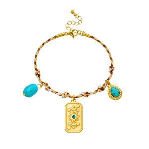 Bohemian braided rope bracelet with gold embossed sun and moon pendants and turquoise stone