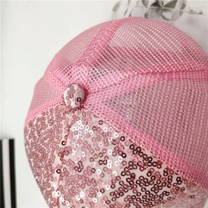 Macro shot of pink sequin baseball cap showing breathable mesh and detailed stitching