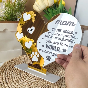 Close-up of heart acrylic ornament with gold mirror finish and poetic mom engraving