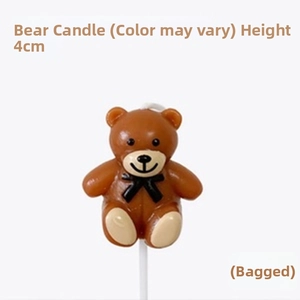 Detailed view of a 4cm brown bear cake candle with a white base for party decoration