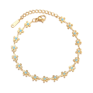 Bohemian style gold stainless steel bracelet with blue floral motifs and adjustable chain