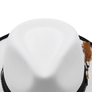 Detail of white fedora hat showing black band, woven leather cord and silk tassels