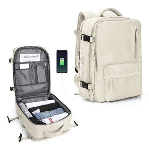 Detailed interior view of beige travel backpack with laptop compartment and USB charging port