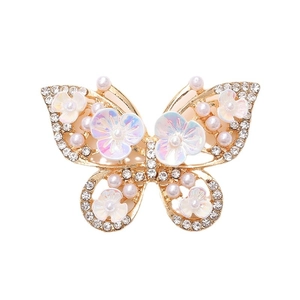Golden butterfly jewelry accessory with white pearls, rhinestones and floral details