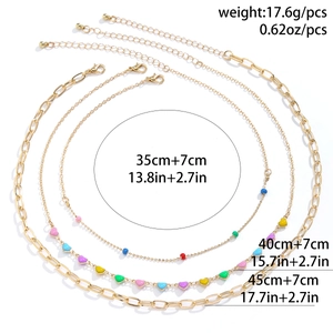 Detailed view of colorful 3-piece necklace set with heart pendant and bead chain specs