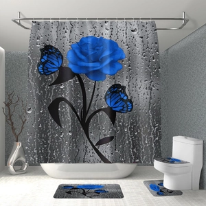 Detail of waterproof blue rose floral shower curtain with matching bathroom rug set