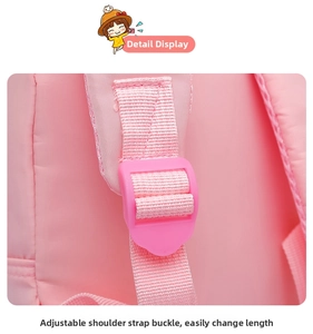 Pink kids backpack detail featuring adjustable plastic buckle and durable shoulder strap