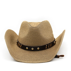 Detailed straw weave texture on western cowboy sun hat with studded leather band