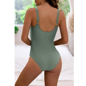 Sage green one-piece swimsuit featuring a backless design and adjustable spaghetti straps