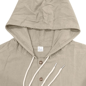 Detail view of linen blend hoodie showing buttons, drawstrings, and fabric texture in beige