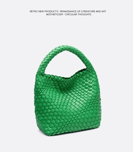 Detail of green hand-woven hobo bag texture and elegant single handle design