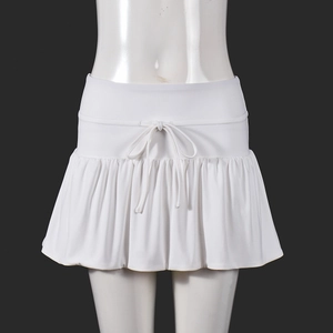 Detailed view of white pleated sports skirt featuring adjustable drawstring waistband