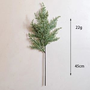 Detail shot showing 45cm artificial pine branch with frosted red berries for Christmas