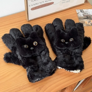 Detail of plush black cat gloves with realistic cat face design and thick fur texture