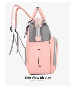 Detailed side view of oxford fabric diaper bag in coral pink and premium grey contrast