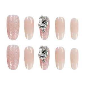 French oval cat-eye press-on nails with pink glitter gradient and rhinestones