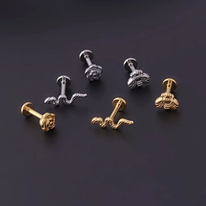 Set of 6 stainless steel labret studs featuring snake, rose, and bee designs in gold and silver
