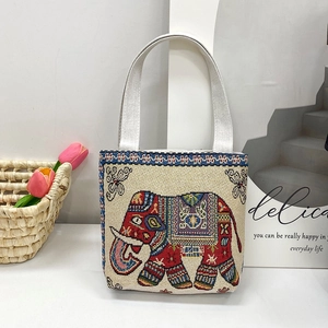 Detail showing the colorful elephant embroidery on a canvas ethnic style tote bag