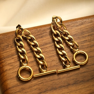 Detail view of 18K gold plated stainless steel Cuban chain earrings with toggle clasp