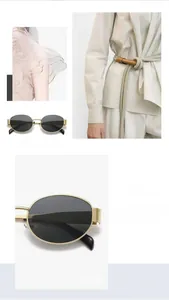 Detail view of oval metal sunglasses featuring gold frames and dark black lenses